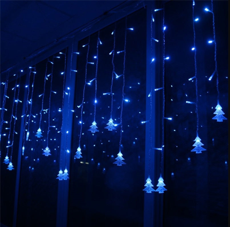Blue LED Christmas icicle lights with tree-shaped decorations hanging indoors