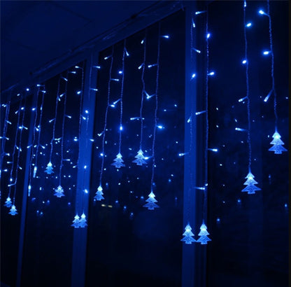 Blue LED Christmas icicle lights with tree-shaped decorations hanging indoors