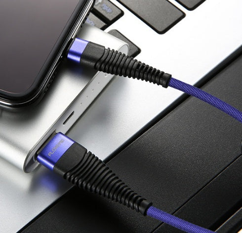 Blue Trendoligy fast charging cable connected to an iPhone and laptop keyboard with purple braided cord