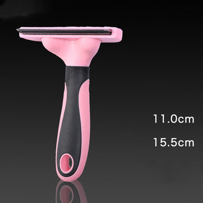 Pink and black pet grooming comb with stainless steel blades for dog shedding, measuring 11cm by 15.5cm