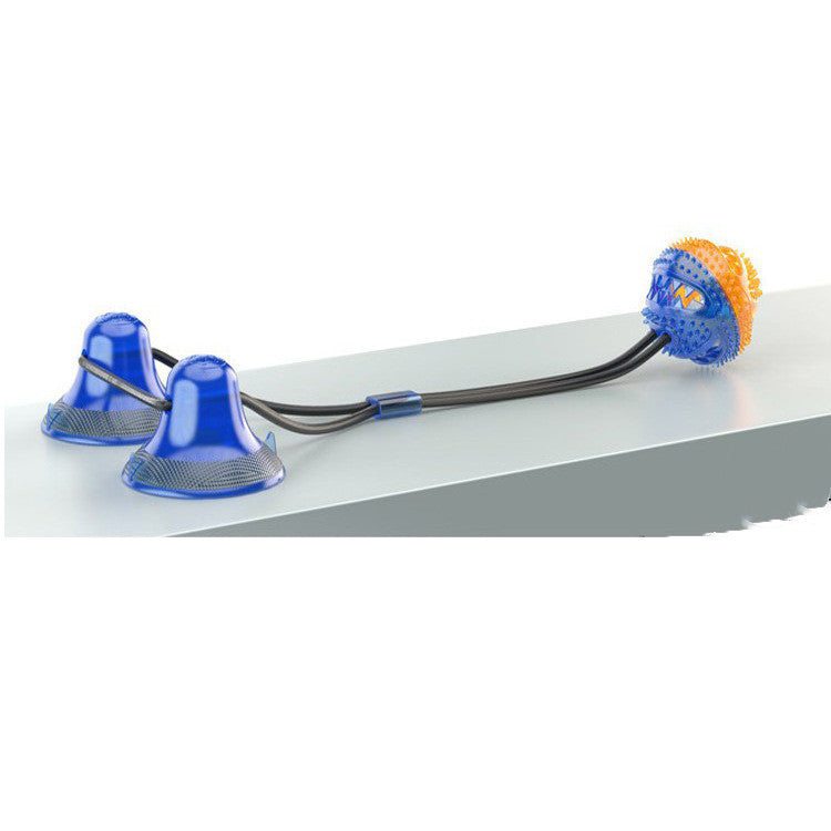 Blue suction cup dog toy with black bungee cords and an orange and blue textured chew ball