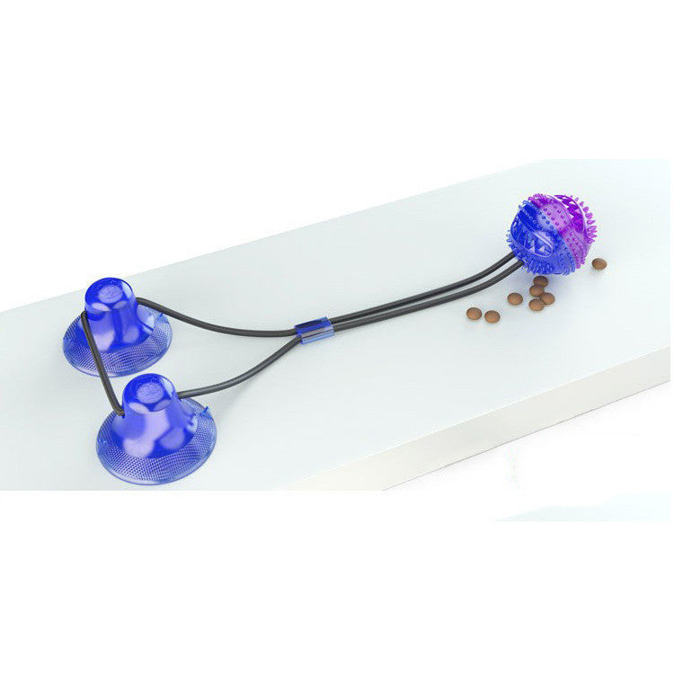 Blue and purple interactive dog toy with suction cups and textured ball for chewing and tugging
