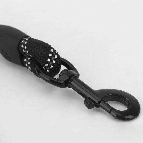 Close-up of black reflective nylon dog leash clip and durable braided handle detail