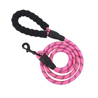Pink reflective nylon dog leash with black padded handle and metal clasp for secure walks