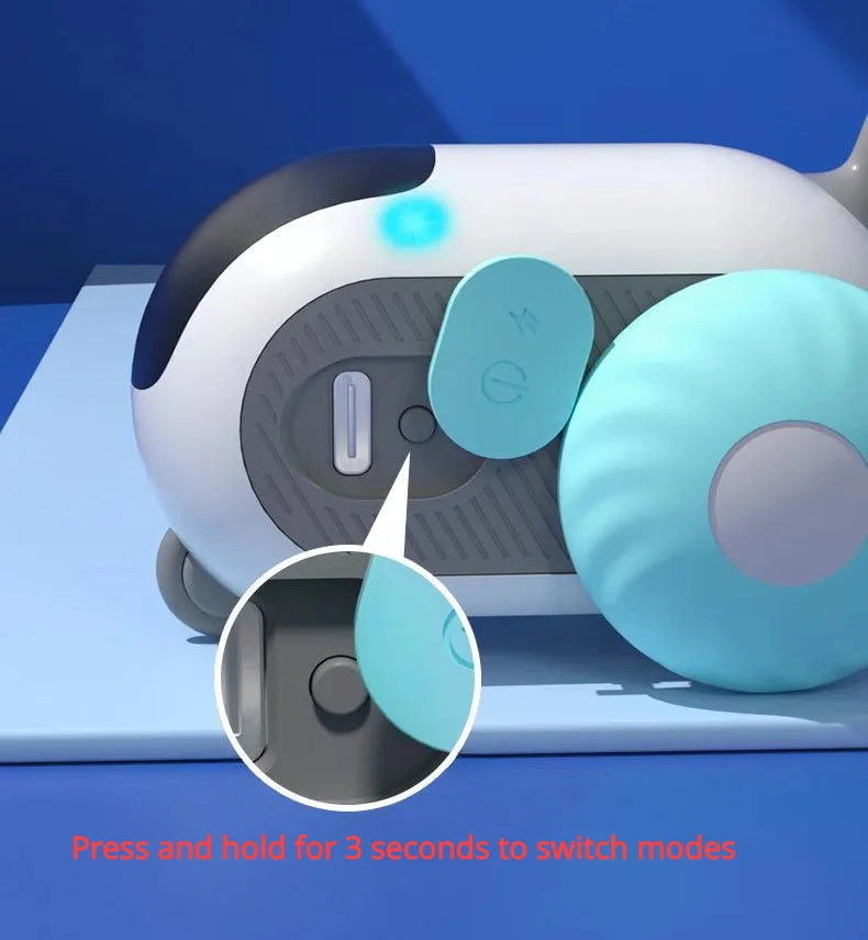 Close-up of blue and white remote control car toy for cats with obstacle avoidance feature on blue surface