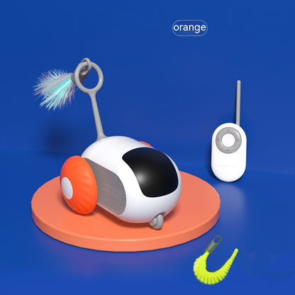 White and orange remote control cat toy car with feather attachment on orange platform against blue background