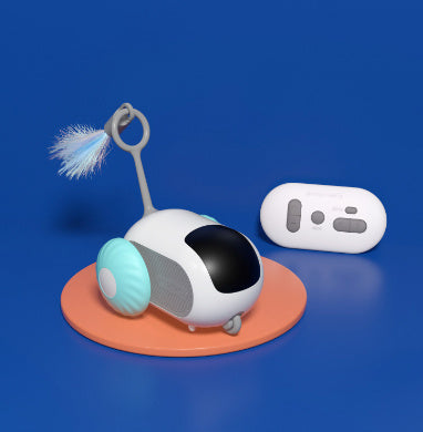 Blue and white remote control cat toy car with feather tail, on orange base against blue background