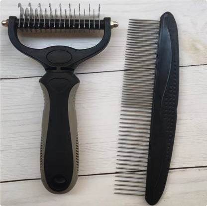 Double sided stainless steel pet comb and black metal pet grooming deshedding tool on light wood