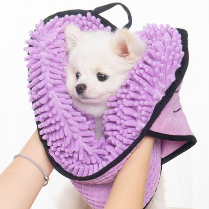 Small white dog wrapped in a purple microfiber super absorbent pet towel with double pockets