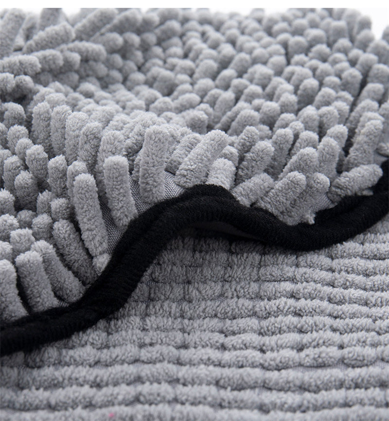 Close-up of soft gray microfiber pet towel with double-pocket design and black trim