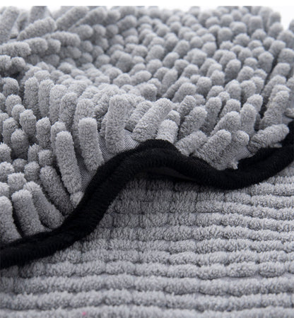 Close-up of soft gray microfiber pet towel with double-pocket design and black trim