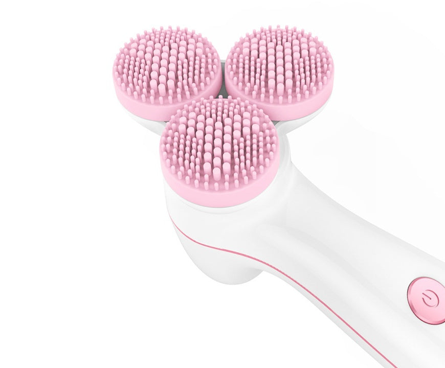 White and pink 3-head silicone facial cleansing brush with soft bristles and power button