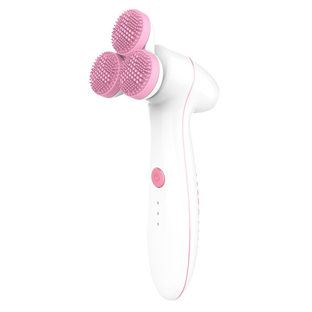 white facial cleansing brush with three pink silicone brush heads and power button