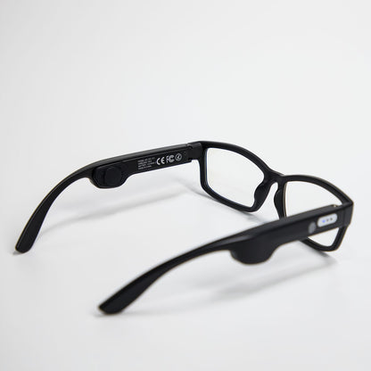 Black smart Bluetooth eyeglasses with rectangular clear lenses on white background