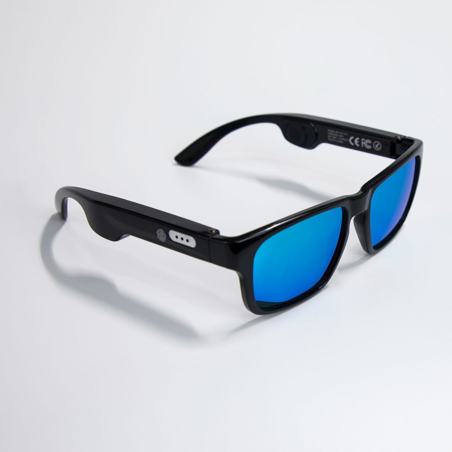 Black smart sunglasses with blue mirrored lenses on white background