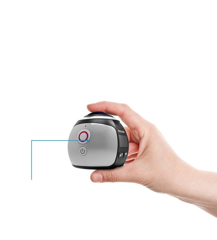 Hand holding compact digital 5MP VR camera with power button and lens on top