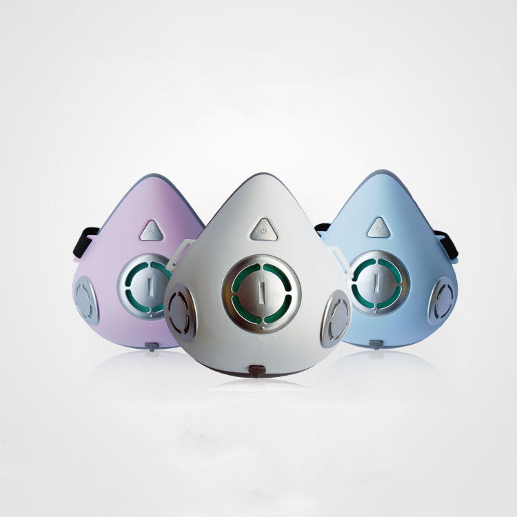 Three Trendoligy electric anti-haze dustproof masks in white, blue, and purple with breather valves