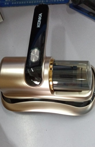 KONKA handheld cordless vacuum cleaner with dust container on metallic base, placed on a gray surface