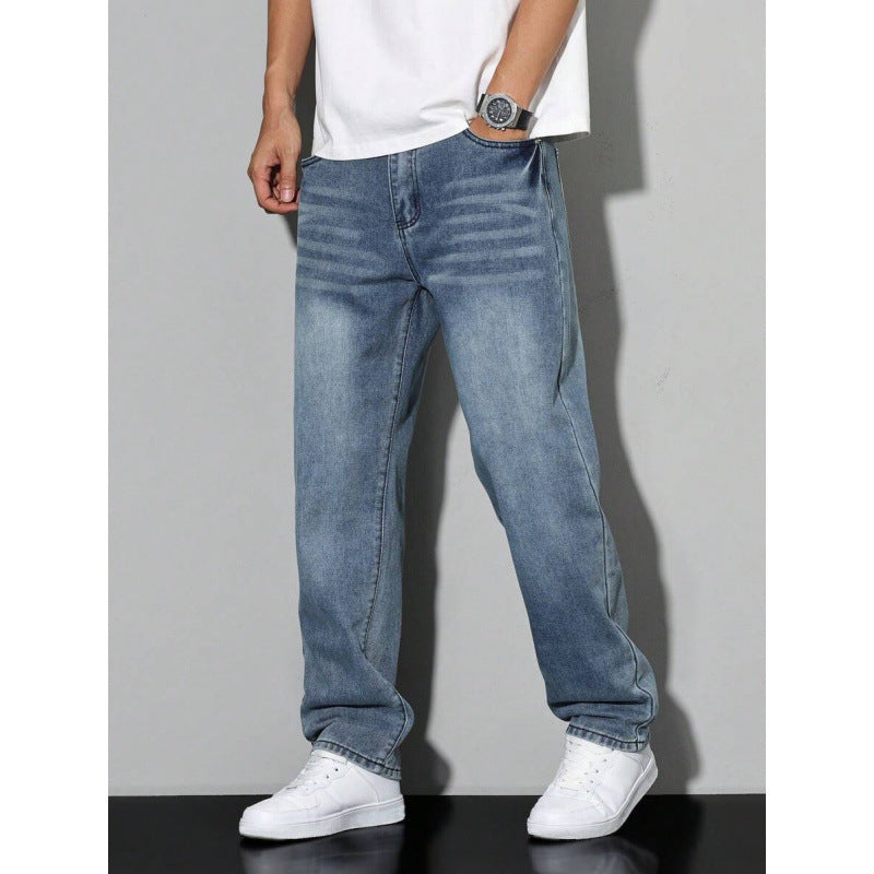 Men wearing blue straight leg loose fit jeans with white sneakers and white t-shirt