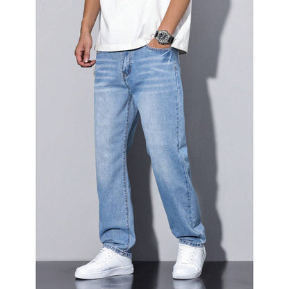 Men's light blue straight leg jeans with loose fit worn with white sneakers and white t-shirt