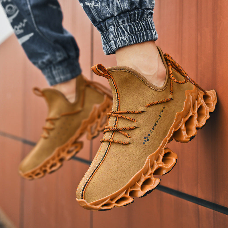 Men's brown leather sneakers with unique textured sole and orange laces, casual low-top footwear