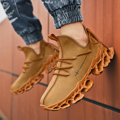 Men's brown leather sneakers with unique textured sole and orange laces, casual low-top footwear