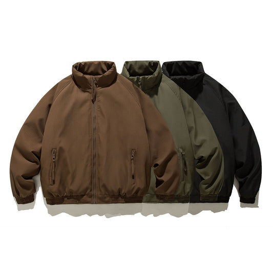 Three unisex loose fit padded jackets in brown, olive green, and black with zipper pockets