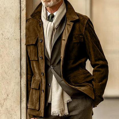 Brown men's suede jacket with lapel collar and button closure, styled over a suit and scarf