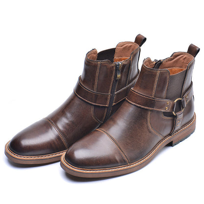 Pair of brown men's leather ankle boots with side zipper and strap detail on white background