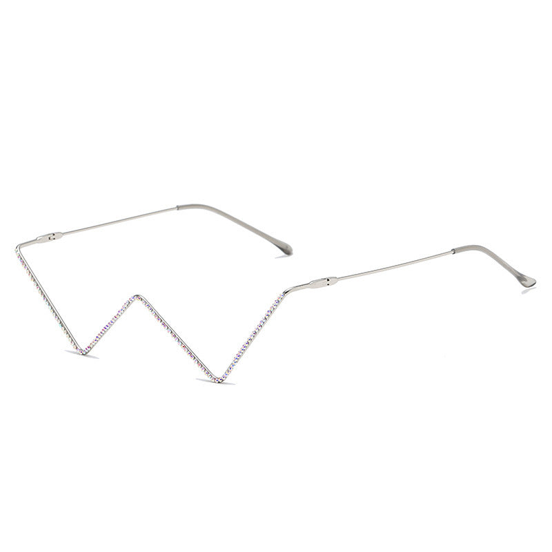 Metal half-frame glasses with zigzag design and rhinestone accents on white background