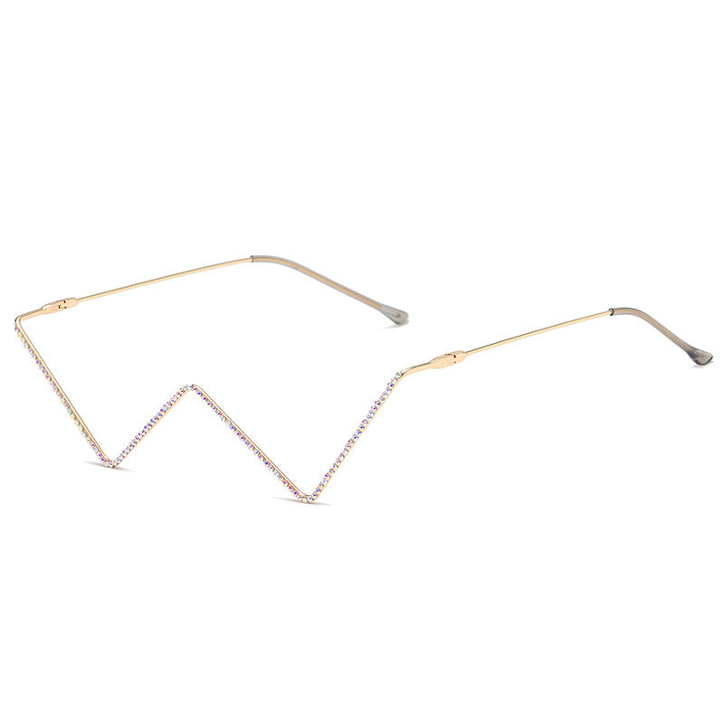 Gold metal half-frame glasses with distinctive zigzag design and rhinestone decoration