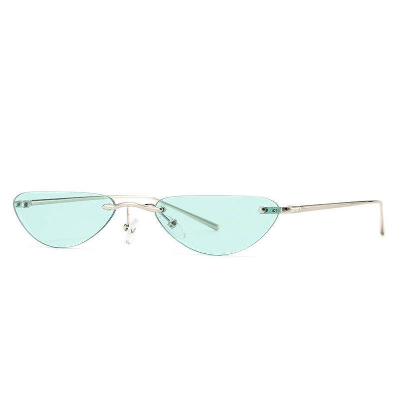 Retro narrow cat eye sunglasses with light blue lenses and thin metallic alloy frame