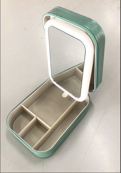 Mint green portable makeup storage box with adjustable LED mirror and divided compartments