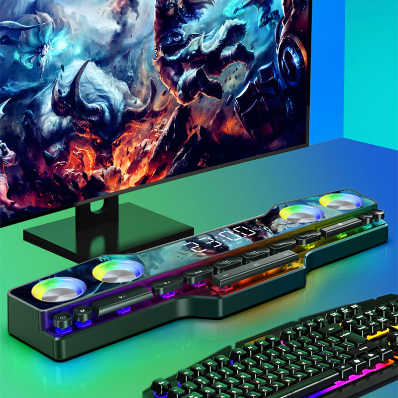 RGB gaming desk speaker with four LED fans, digital display, and mechanical keyboard under a monitor