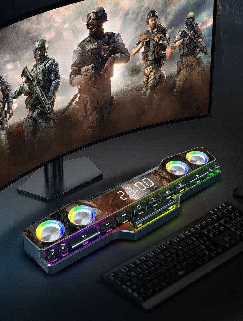 RGB Bluetooth desktop gaming speaker with digital clock and control buttons under curved monitor displaying soldiers