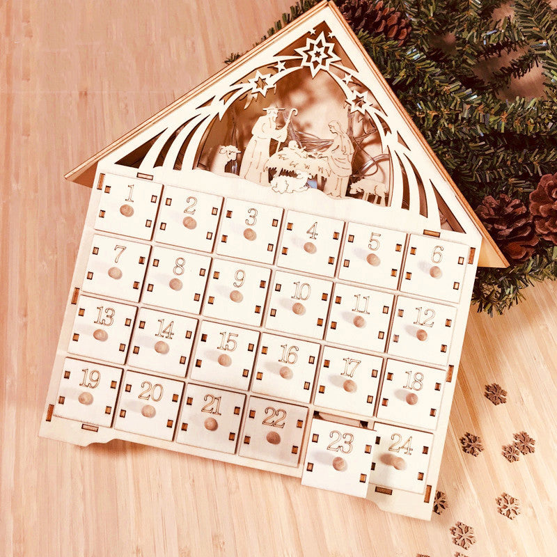 Wooden DIY Christmas advent calendar with nativity scene and numbered drawers for holiday countdown