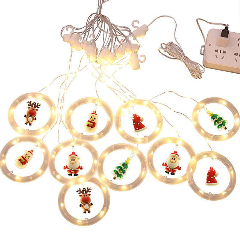 USB-powered LED Christmas string lights with glowing rings and hanging festive characters like Santa, reindeer, snowman, and tree