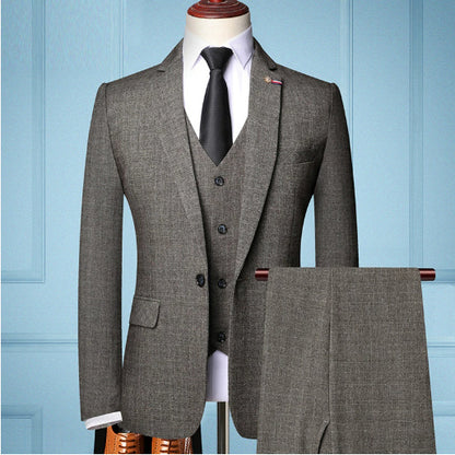 Coffee brown men's three-piece suit with black tie and white dress shirt on mannequin