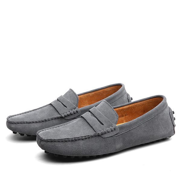 Men's dark blue suede driving loafers with rubber anti-skid sole and penny strap detail