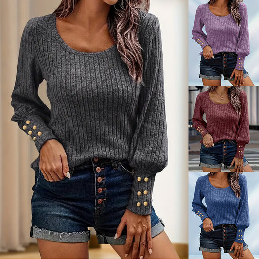 Women wearing ribbed knit sweaters with gold button details on sleeves in gray, purple, burgundy, and blue paired with denim shorts