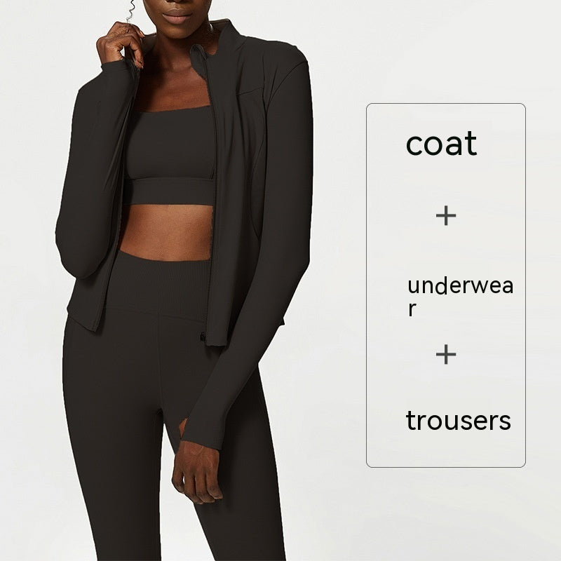 plus size woman wearing dark green quick-dry activewear set with coat, crop top, and high-waisted leggings