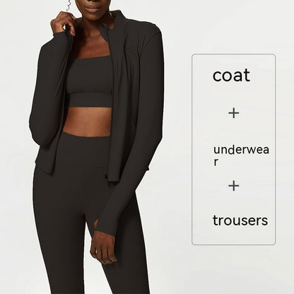 plus size woman wearing dark green quick-dry activewear set with coat, crop top, and high-waisted leggings