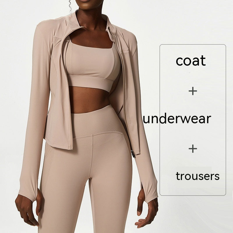 Plus size model wearing nude beige quick dry activewear set with sports bra, jacket, and high-waisted leggings