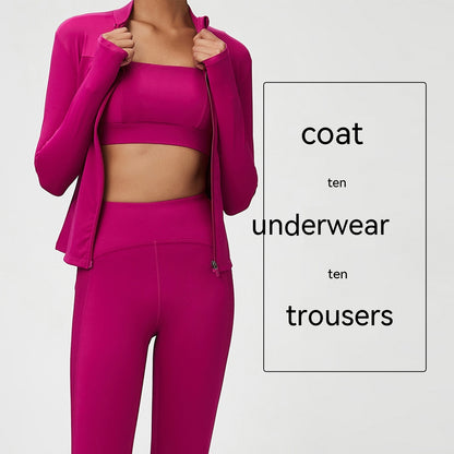 woman wearing a bright magenta three-piece activewear set with zip-up jacket, crop top, and high-waisted leggings
