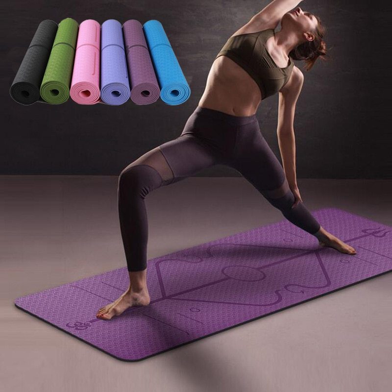 Woman practicing yoga on purple non-slip TPE yoga mat with position lines, stack of colorful rolled mats