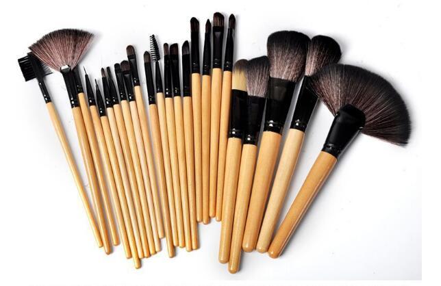 24-piece professional makeup brush set with wooden handles and various brush shapes on white background