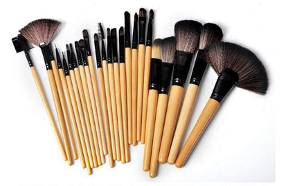 24-piece professional makeup brush set with wooden handles and various brush shapes on white background