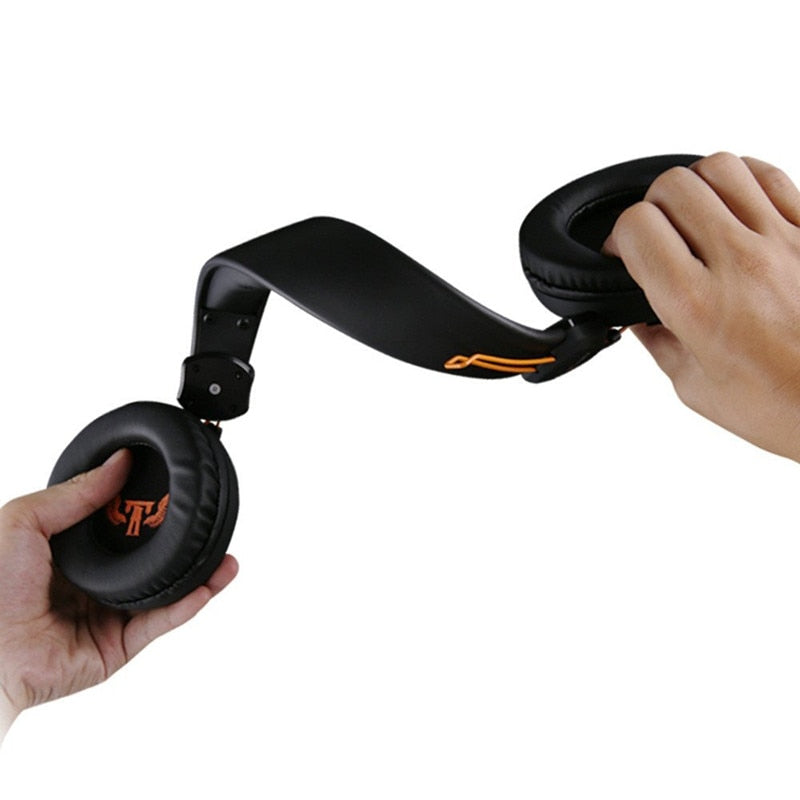 Hands holding flexible black Trendoligy X7 Pro gaming headset with padded ear cups and orange logo