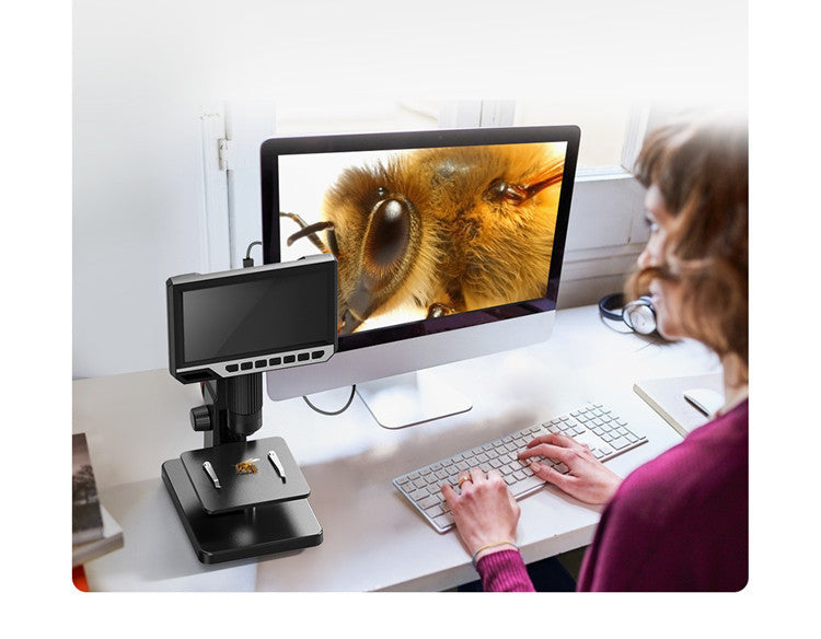 Person using Trendoligy digital USB microscope showing close-up honeybee image on computer screen
