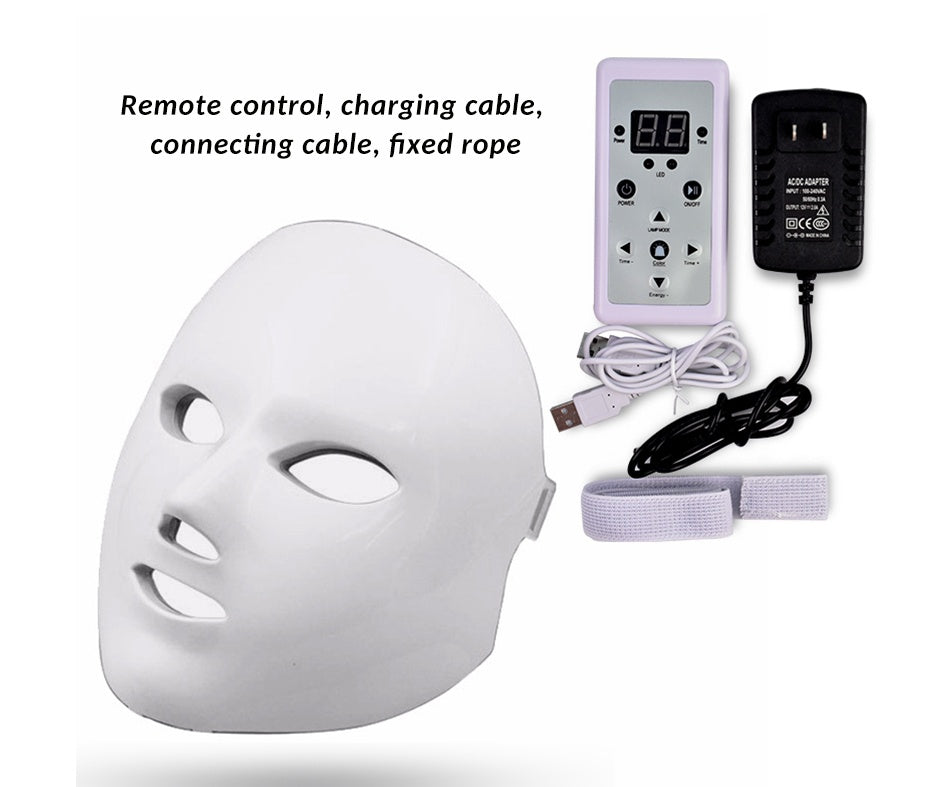White LED facial beauty mask with remote control, charging cables, and fixed strap for skin rejuvenation
